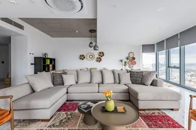 a living room with a couch and a table at Gorgeous 3BD2Bath Bright Airy Penthouse! #355 in Istanbul