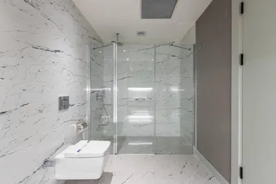 a bathroom with a shower with a toilet and a sink at Gorgeous 3BD2Bath Bright Airy Penthouse! #355 in Istanbul