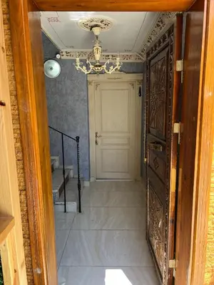 an entrance to a hallway with a door and a staircase at Mihri Hatun Suite in Istanbul