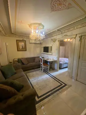 a living room with a couch and a table at Mihri Hatun Suite in Istanbul