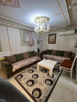 a living room with a couch and a table at Mihri Hatun Suite in Istanbul