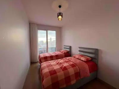 two beds in a room with a window at Cozy Homes - 2 Rooms & 1 Living room Apartment in Esenyurt