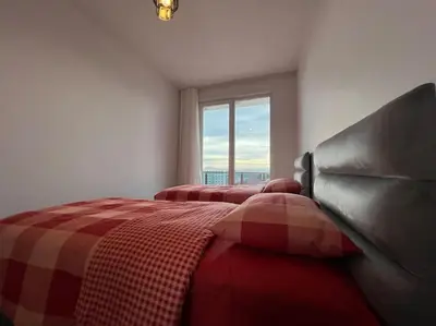 a bedroom with two beds and a window at Cozy Homes 2 Room Apartment Well Designed in Esenyurt