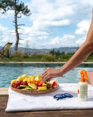 a person cutting a plate of fruit on a table at Stay in Sapanca in Sapanca