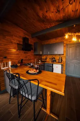 a kitchen with a wooden table and chairs at Stay in Sapanca in Sapanca