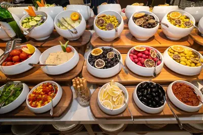 a buffet with bowls of different types of food at Rayelin Hotel Old Town in Istanbul