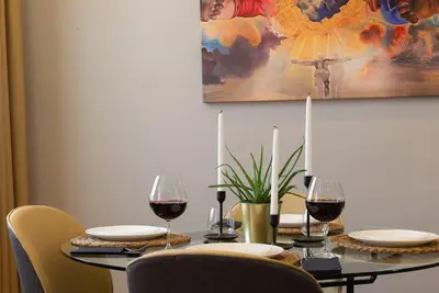 a dining room table with glasses of red wine at The best of the Bosphorus & comfortable apartment in Istanbul