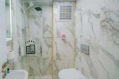 a bathroom with a shower and a toilet at Ozer Hotel & Apartments in Istanbul