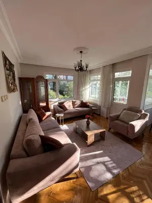 a living room with two couches and a table at Acıbadem Kadıköy Daire in Istanbul
