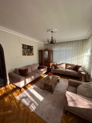 a living room with two couches and a coffee table at Acıbadem Kadıköy Daire in Istanbul