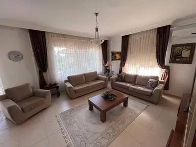 a living room with two couches and a coffee table at Aktaş Gümüşyaka Villaları in Silivri