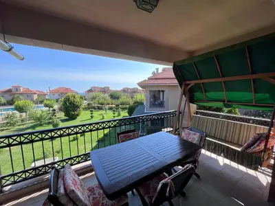 a balcony with a table and chairs and a view at Aktaş Gümüşyaka Villaları in Silivri