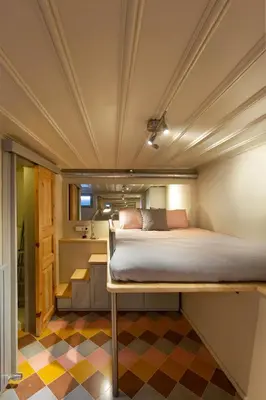 a bed in a room with a checkered floor at Tastefully decorated house in Old city - Rose in Istanbul