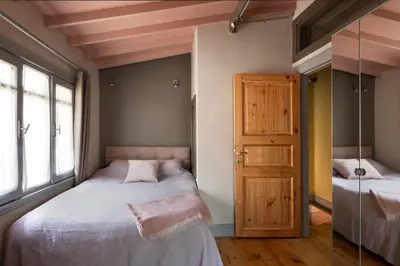 a bedroom with two beds and a door at Tastefully decorated house in Old city - Rose in Istanbul