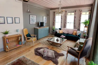 a living room with a couch and a table at Tastefully decorated house in Old city - Rose in Istanbul
