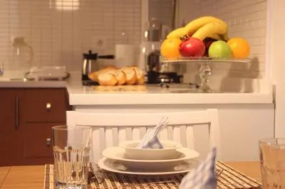 a kitchen with a table with a bowl of fruit at TownHouse Istanbul in Istanbul