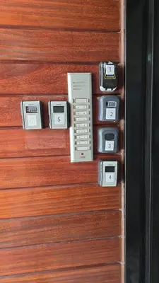 a row of cell phones on a wooden door at TownHouse Istanbul in Istanbul