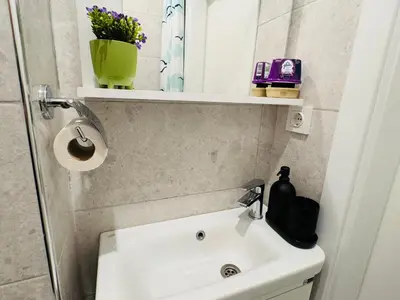 a bathroom with a white sink and a mirror at Jasmin in Istanbul