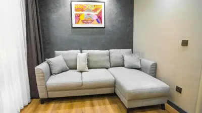 a living room with a couch in a room at Sea Sparkle in Istanbul