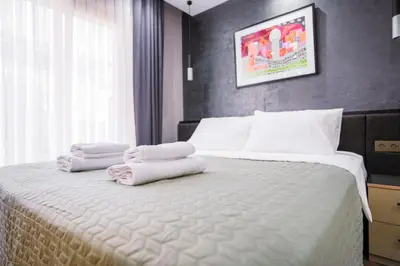 a bedroom with a bed with towels on it at Sea Sparkle in Istanbul