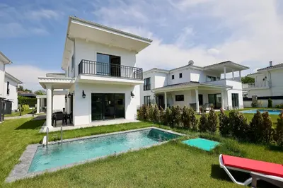 a house with a swimming pool in the yard at Orkide Sapanca in Sapanca