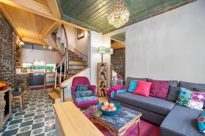 a living room with a couch and a table at Turquoise House Featured in Elle Decor Magazine in Istanbul