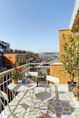 a patio with a table and chairs on a balcony at Golden Horn Views from The Saffron House in Old Istanbul in Istanbul