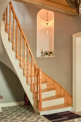 a staircase in a home with a pendant light at Nostalgic & Comfortable Historical Home! in Istanbul