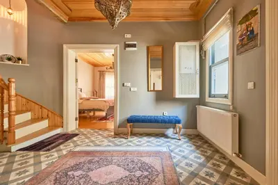 a hallway with a blue bench in a room at Nostalgic & Comfortable Historical Home! in Istanbul