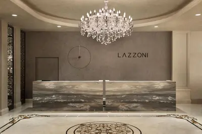 a chandelier in a room with a painting on the wall at Lazzoni Hotel in Istanbul