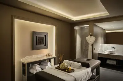 a bathroom with a bed and a sink and a tub at Lazzoni Hotel in Istanbul