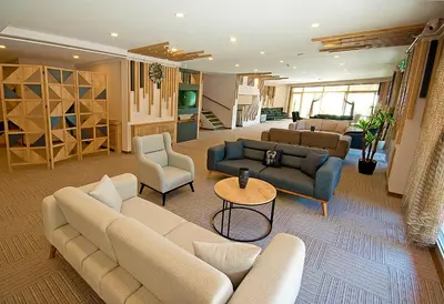 a large living room with couches and chairs at Lion City Hotel in Buyukcekmece