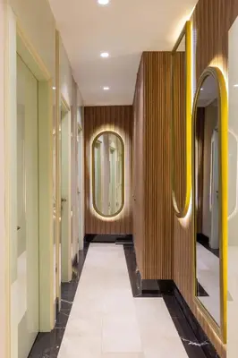 a hallway with a mirror and a tile floor at Great Fortune Concept Hotel in Istanbul