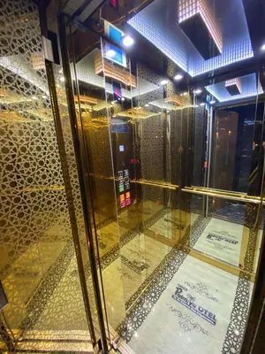 a glass window in a building with a sign on it at Green Palmiye Hotel in Avcılar