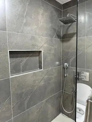 a shower with a glass door in a bathroom at Bamboo Grove 2 and 3 bedroom apartments - Izmit Kocaeli in Çavuşçiftliği