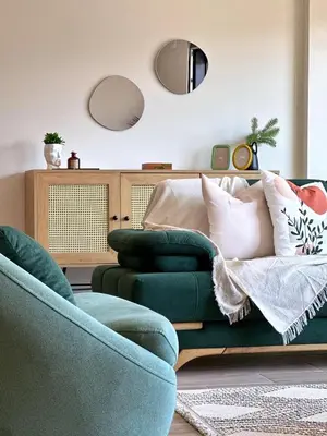 a living room with a green couch and two chairs at Bamboo Grove 2 and 3 bedroom apartments - Izmit Kocaeli in Çavuşçiftliği