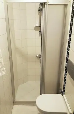 a bathroom with a shower with a toilet in it at Super Location Cosy Apartment TaximHome 3 at Taksim Cihangir in Istanbul