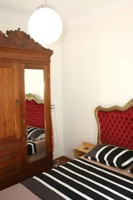 a bedroom with a bed and a dresser and a mirror at Super Location Cosy Apartment TaximHome 3 at Taksim Cihangir in Istanbul
