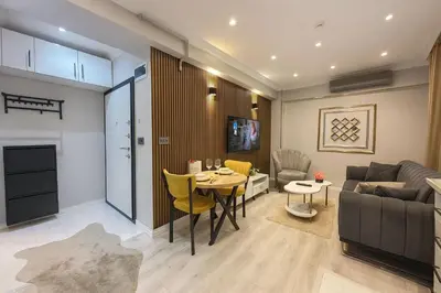 a living room with a couch and a table at Casa Florya Suites in Istanbul