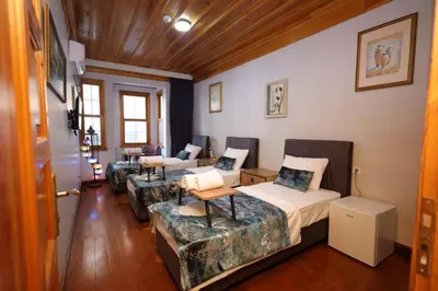 a living room with two beds and a couch at The Trip Anex Hotel in Istanbul