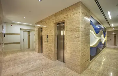 a lobby with a wall with a painting on it at The Leos Residence in Istanbul