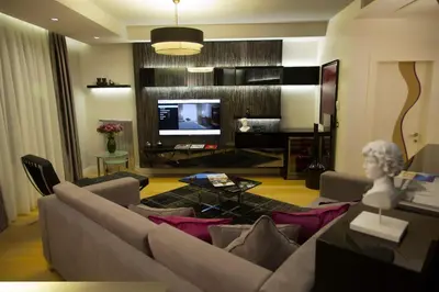 a living room with a couch and a television at The Leos Residence in Istanbul