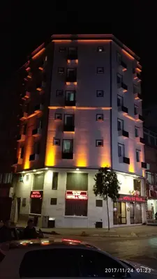 a large building with lights on the side of it at Hotel Oz Villa in Istanbul