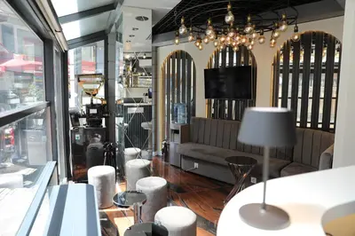 a store with a couch and stools in a room at Madrigal Boutıque Hotel in Istanbul