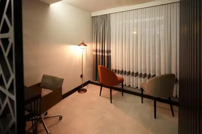 a room with chairs and a table and a window at Visse Hotel in Mudanya