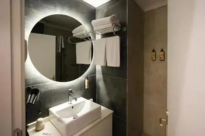 a bathroom with a sink and a mirror at Visse Hotel in Mudanya