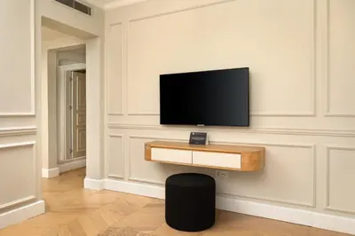 a living room with a flat screen tv on a wall at Vucino Suites in Istanbul