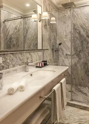 a bathroom with a sink and a shower at Nevv Bosphorus Hotel & Suites in Istanbul