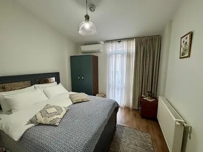 a bedroom with a large bed in a room at Modern Furnished Historical House in Istanbul