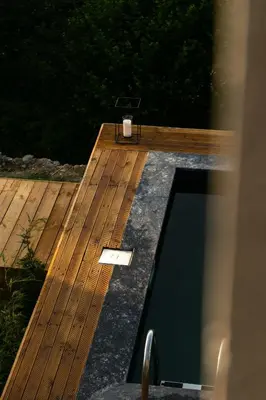 a wooden deck with a candle on top of it at PANA Sapanca Lake View in Sapanca